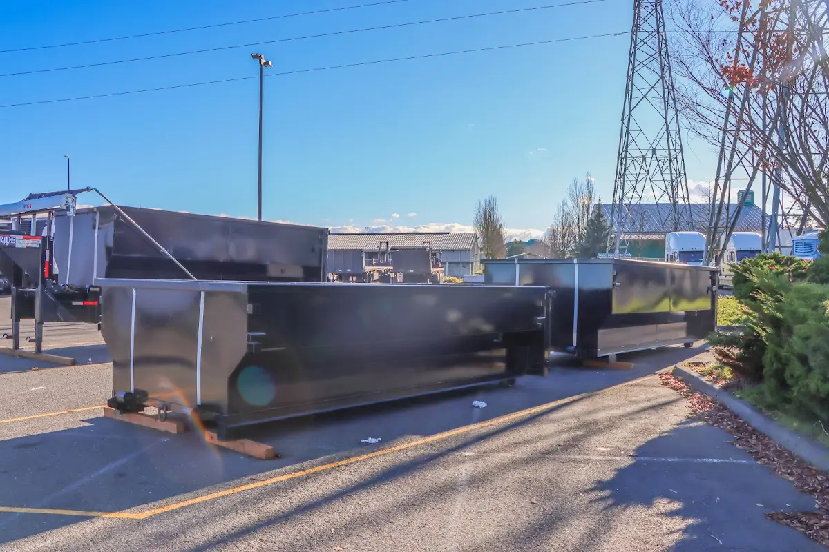 Roll-off dumpster ready for waste disposal at job site for Yard Waste Dumpster Rental in Granville